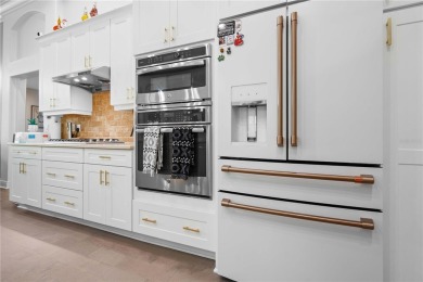 Experience luxury living in this stunning 4-bedroom, 3-bath pool on Westchase Golf Club in Florida - for sale on GolfHomes.com, golf home, golf lot