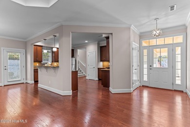 Experience refined coastal living in this beautifully designed on Cape Fear National At Brunswick Forest in North Carolina - for sale on GolfHomes.com, golf home, golf lot