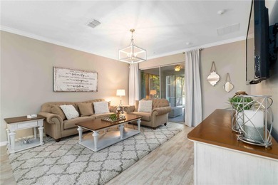 Discover refined Florida living in this beautifully updated pool on Esplanade Golf and Country at Lakewood Ranch in Florida - for sale on GolfHomes.com, golf home, golf lot