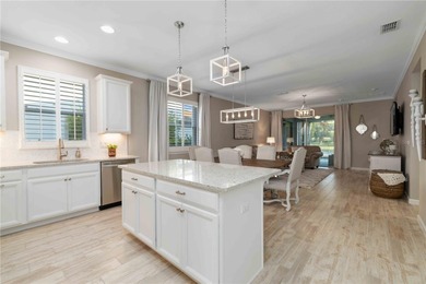 Discover refined Florida living in this beautifully updated pool on Esplanade Golf and Country at Lakewood Ranch in Florida - for sale on GolfHomes.com, golf home, golf lot