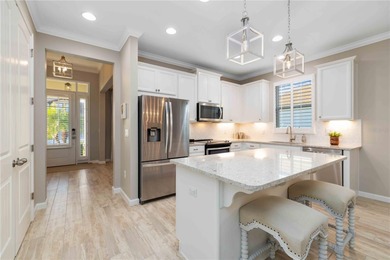 Discover refined Florida living in this beautifully updated pool on Esplanade Golf and Country at Lakewood Ranch in Florida - for sale on GolfHomes.com, golf home, golf lot