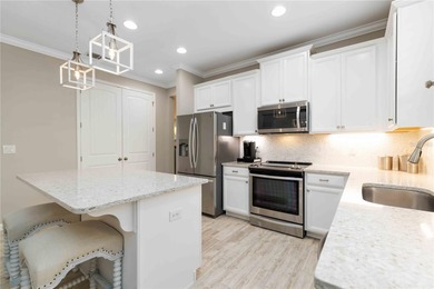 Discover refined Florida living in this beautifully updated pool on Esplanade Golf and Country at Lakewood Ranch in Florida - for sale on GolfHomes.com, golf home, golf lot