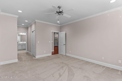 Experience refined coastal living in this beautifully designed on Cape Fear National At Brunswick Forest in North Carolina - for sale on GolfHomes.com, golf home, golf lot