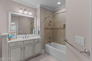 Experience refined coastal living in this beautifully designed on Cape Fear National At Brunswick Forest in North Carolina - for sale on GolfHomes.com, golf home, golf lot