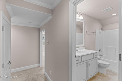 Experience refined coastal living in this beautifully designed on Cape Fear National At Brunswick Forest in North Carolina - for sale on GolfHomes.com, golf home, golf lot