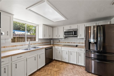 Located in the heart of Corpus Christi, this spacious two-story on Corpus Christi Country Club Golf Course in Texas - for sale on GolfHomes.com, golf home, golf lot