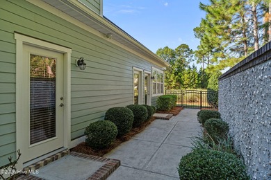 Experience refined coastal living in this beautifully designed on Cape Fear National At Brunswick Forest in North Carolina - for sale on GolfHomes.com, golf home, golf lot