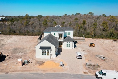 Designed by renowned architect John Williams, this elegant new on Camp Creek Golf Course in Florida - for sale on GolfHomes.com, golf home, golf lot