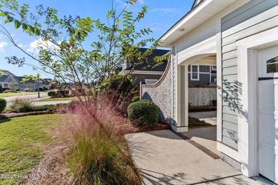 Experience refined coastal living in this beautifully designed on Cape Fear National At Brunswick Forest in North Carolina - for sale on GolfHomes.com, golf home, golf lot