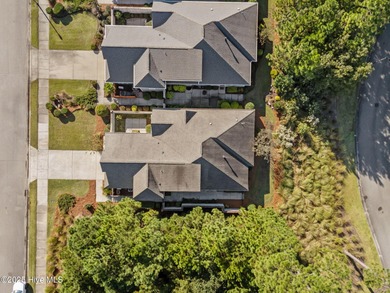 Experience refined coastal living in this beautifully designed on Cape Fear National At Brunswick Forest in North Carolina - for sale on GolfHomes.com, golf home, golf lot