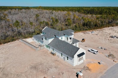 Designed by renowned architect John Williams, this elegant new on Camp Creek Golf Course in Florida - for sale on GolfHomes.com, golf home, golf lot