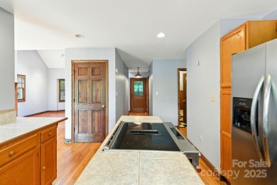 Nestled on a peaceful hilltop, this spacious 3-bedroom on Black Mountain Golf Course in North Carolina - for sale on GolfHomes.com, golf home, golf lot