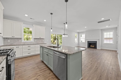 Welcome home to this spacious 4-bedroom, 2.5-bath residence on Olde Liberty Golf and Country Club in North Carolina - for sale on GolfHomes.com, golf home, golf lot