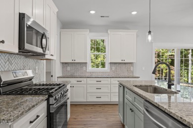 Welcome home to this spacious 4-bedroom, 2.5-bath residence on Olde Liberty Golf and Country Club in North Carolina - for sale on GolfHomes.com, golf home, golf lot