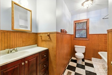 Nestled on a peaceful hilltop, this spacious 3-bedroom on Black Mountain Golf Course in North Carolina - for sale on GolfHomes.com, golf home, golf lot