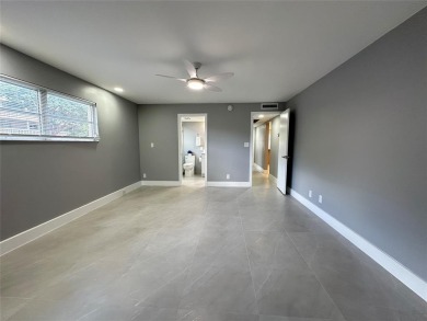 Beautifully renovated 2-bedroom, 2-bath first-floor corner unit on Wynmoor Golf Course in Florida - for sale on GolfHomes.com, golf home, golf lot