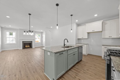 Welcome home to this spacious 4-bedroom, 2.5-bath residence on Olde Liberty Golf and Country Club in North Carolina - for sale on GolfHomes.com, golf home, golf lot