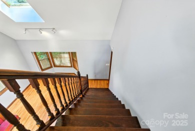 Nestled on a peaceful hilltop, this spacious 3-bedroom on Black Mountain Golf Course in North Carolina - for sale on GolfHomes.com, golf home, golf lot