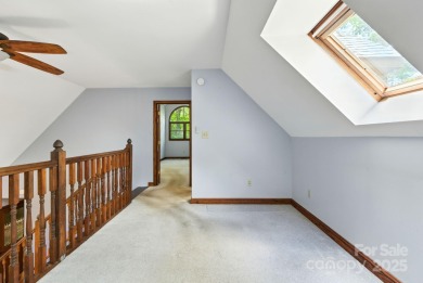 Nestled on a peaceful hilltop, this spacious 3-bedroom on Black Mountain Golf Course in North Carolina - for sale on GolfHomes.com, golf home, golf lot