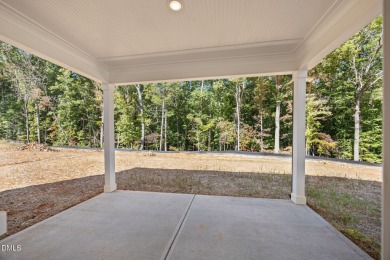 Welcome home to this spacious 4-bedroom, 2.5-bath residence on Olde Liberty Golf and Country Club in North Carolina - for sale on GolfHomes.com, golf home, golf lot