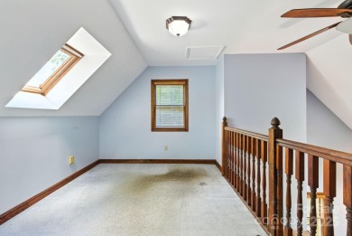 Nestled on a peaceful hilltop, this spacious 3-bedroom on Black Mountain Golf Course in North Carolina - for sale on GolfHomes.com, golf home, golf lot