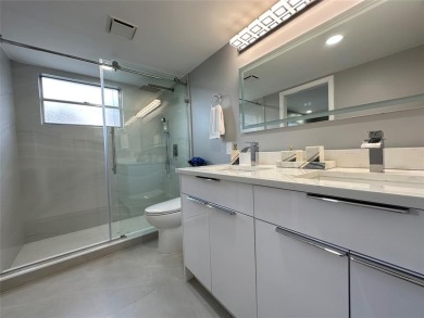 Beautifully renovated 2-bedroom, 2-bath first-floor corner unit on Wynmoor Golf Course in Florida - for sale on GolfHomes.com, golf home, golf lot