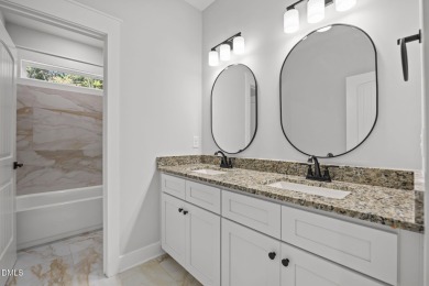 Welcome home to this spacious 4-bedroom, 2.5-bath residence on Olde Liberty Golf and Country Club in North Carolina - for sale on GolfHomes.com, golf home, golf lot