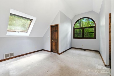 Nestled on a peaceful hilltop, this spacious 3-bedroom on Black Mountain Golf Course in North Carolina - for sale on GolfHomes.com, golf home, golf lot