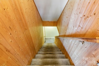 Nestled on a peaceful hilltop, this spacious 3-bedroom on Black Mountain Golf Course in North Carolina - for sale on GolfHomes.com, golf home, golf lot