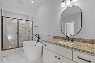 Welcome home to this spacious 4-bedroom, 2.5-bath residence on Olde Liberty Golf and Country Club in North Carolina - for sale on GolfHomes.com, golf home, golf lot