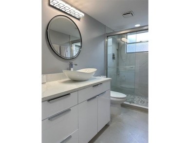 Beautifully renovated 2-bedroom, 2-bath first-floor corner unit on Wynmoor Golf Course in Florida - for sale on GolfHomes.com, golf home, golf lot