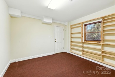 Nestled on a peaceful hilltop, this spacious 3-bedroom on Black Mountain Golf Course in North Carolina - for sale on GolfHomes.com, golf home, golf lot