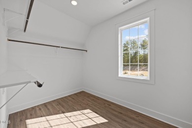 Welcome home to this spacious 4-bedroom, 2.5-bath residence on Olde Liberty Golf and Country Club in North Carolina - for sale on GolfHomes.com, golf home, golf lot