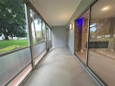 Beautifully renovated 2-bedroom, 2-bath first-floor corner unit on Wynmoor Golf Course in Florida - for sale on GolfHomes.com, golf home, golf lot