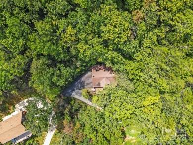 Nestled on a peaceful hilltop, this spacious 3-bedroom on Black Mountain Golf Course in North Carolina - for sale on GolfHomes.com, golf home, golf lot