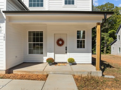 Welcome home to this spacious 4-bedroom, 2.5-bath residence on Olde Liberty Golf and Country Club in North Carolina - for sale on GolfHomes.com, golf home, golf lot