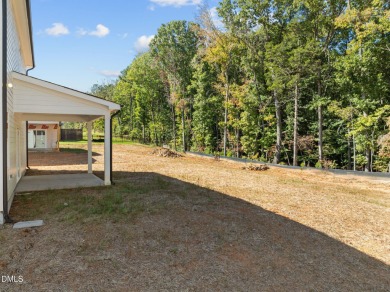 Welcome home to this spacious 4-bedroom, 2.5-bath residence on Olde Liberty Golf and Country Club in North Carolina - for sale on GolfHomes.com, golf home, golf lot