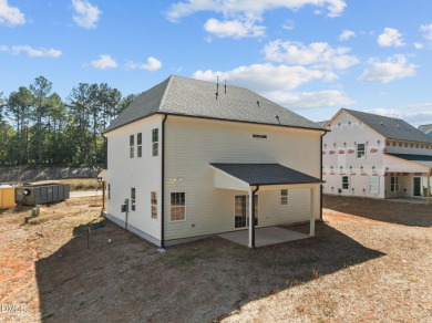 Welcome home to this spacious 4-bedroom, 2.5-bath residence on Olde Liberty Golf and Country Club in North Carolina - for sale on GolfHomes.com, golf home, golf lot