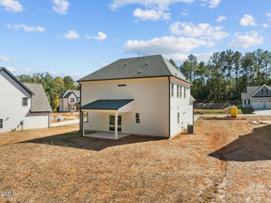 Welcome home to this spacious 4-bedroom, 2.5-bath residence on Olde Liberty Golf and Country Club in North Carolina - for sale on GolfHomes.com, golf home, golf lot