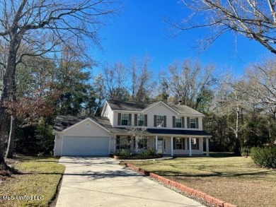 This spacious 2 story home is located on a quiet cul-de-sac on Diamondhead Country Club in Mississippi - for sale on GolfHomes.com, golf home, golf lot