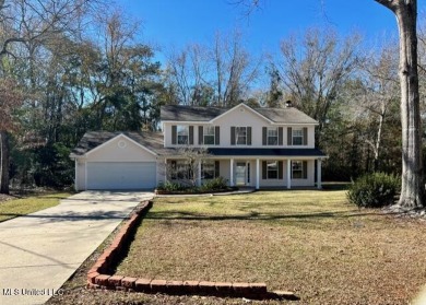 This spacious 2 story home is located on a quiet cul-de-sac on Diamondhead Country Club in Mississippi - for sale on GolfHomes.com, golf home, golf lot