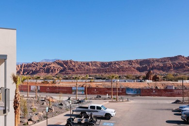This top-floor unit has stunning Red Rock views to the East on Entrada at Snow Canyon in Utah - for sale on GolfHomes.com, golf home, golf lot