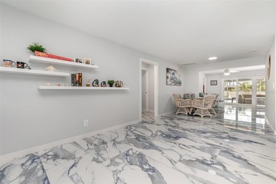 DISCOVER THE WATERFRONT LIFESTYLE YOU'VE BEEN DREAMING OF on El Rio Golf Course and Club in Florida - for sale on GolfHomes.com, golf home, golf lot