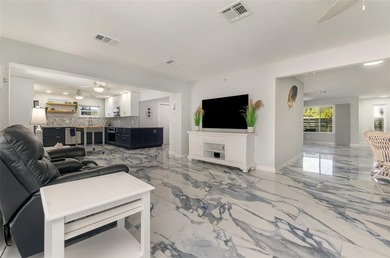 DISCOVER THE WATERFRONT LIFESTYLE YOU'VE BEEN DREAMING OF on El Rio Golf Course and Club in Florida - for sale on GolfHomes.com, golf home, golf lot