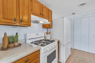 Welcome home to this charming home surrounded by majestic on Tucson Estates Golf Course in Arizona - for sale on GolfHomes.com, golf home, golf lot