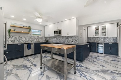 DISCOVER THE WATERFRONT LIFESTYLE YOU'VE BEEN DREAMING OF on El Rio Golf Course and Club in Florida - for sale on GolfHomes.com, golf home, golf lot