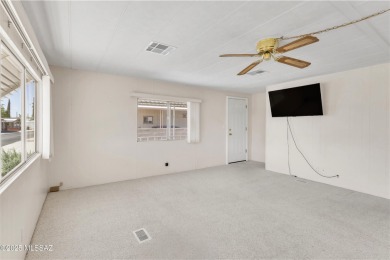 Welcome home to this charming home surrounded by majestic on Tucson Estates Golf Course in Arizona - for sale on GolfHomes.com, golf home, golf lot