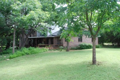 4 BR 2.5 bath home nestled on .55 acres (2 lots) surrounded by on White Bluff Resort - New Course in Texas - for sale on GolfHomes.com, golf home, golf lot