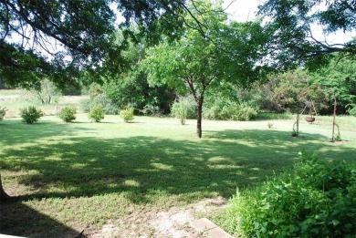 4 BR 2.5 bath home nestled on .55 acres (2 lots) surrounded by on White Bluff Resort - New Course in Texas - for sale on GolfHomes.com, golf home, golf lot