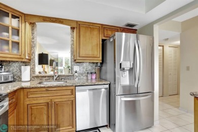 ALL IMPACT WINDOWS, BEAUTIFUL STAINLESS APPLIANCES WASHER DRYER on Oriole Golf and Tennis Club in Florida - for sale on GolfHomes.com, golf home, golf lot